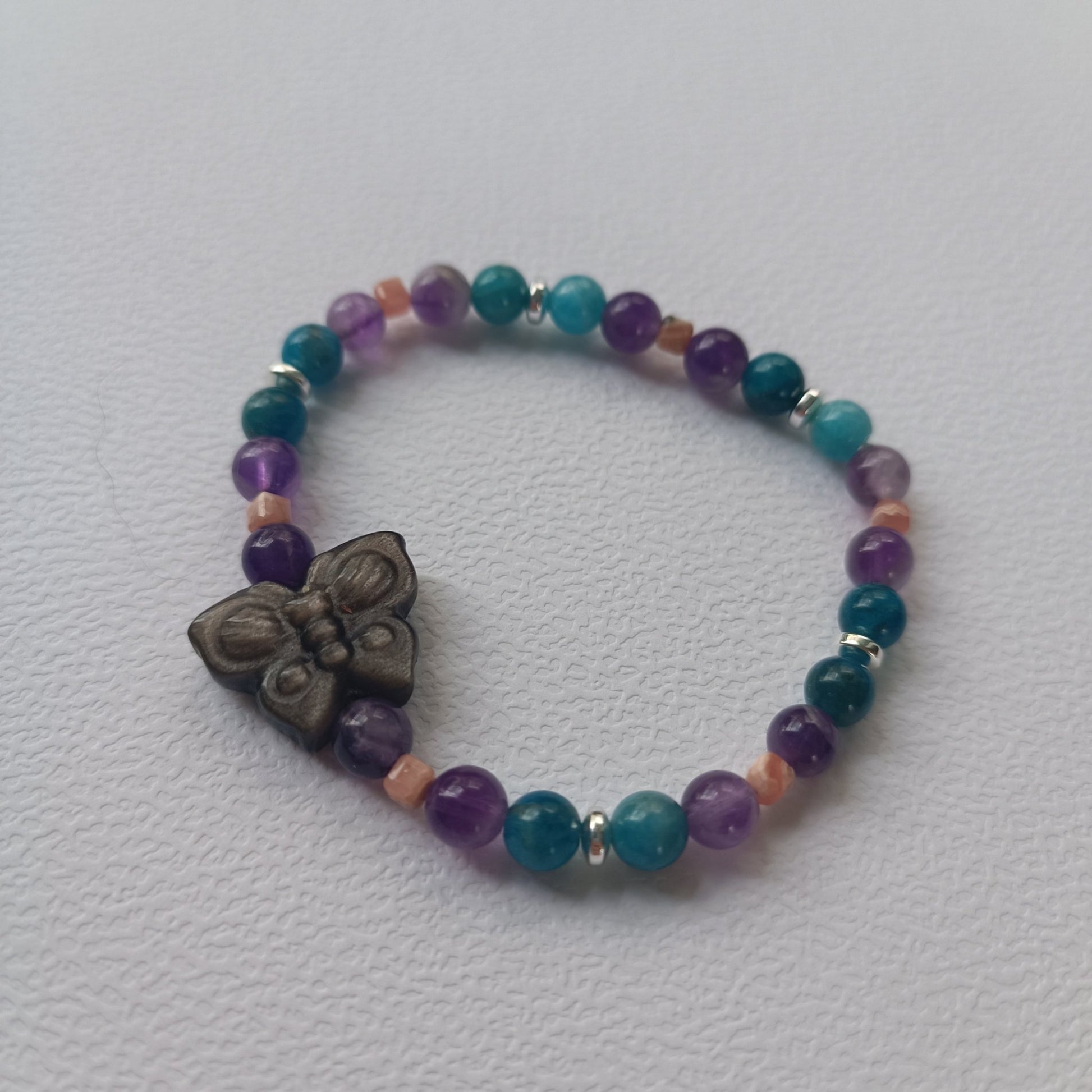 Réservé - Bracelet Papillon – Obsidienne Argentée, Apatite Bleue, Améthyste & Rhodochrosite (6 mm) – 17 cm | Douceur & Éveil intérieur - Cybele Pierres