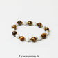 Pulsera Aphaia – Ojo de Tigre (8 mm) y Howlita (6 mm) - 17 cm | Serenidad y Determinación